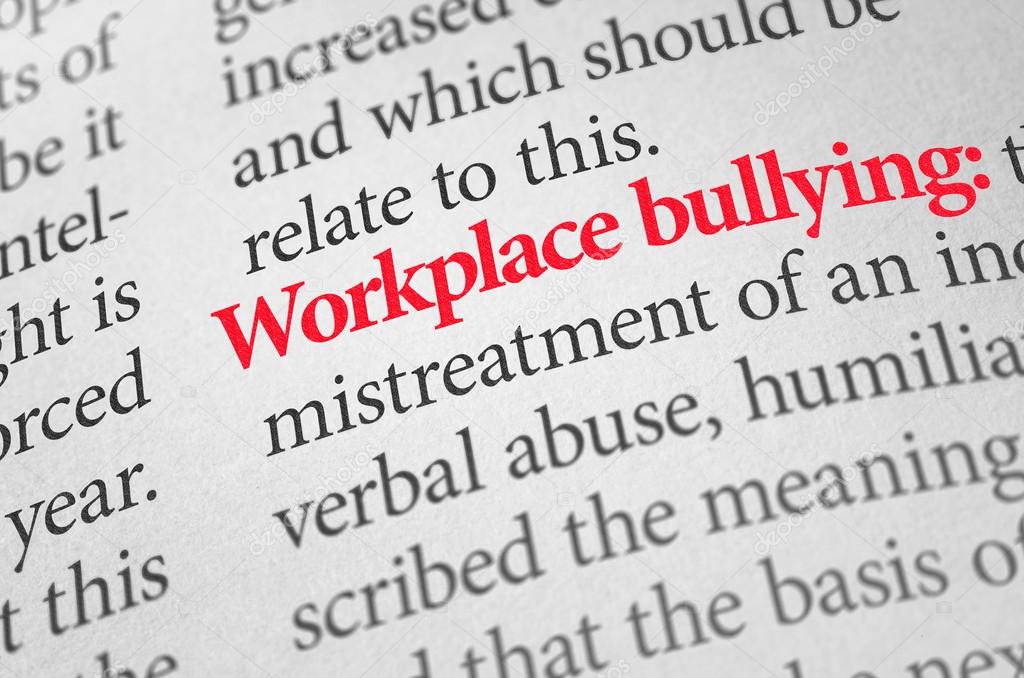 Definition of the term Workplace bullying in a dictionary Stock Photo