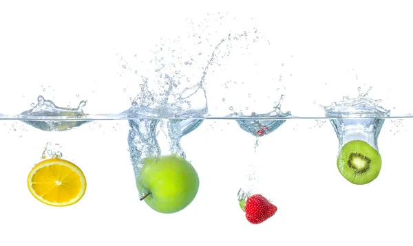 Fresh fruits falling into water with splashes — Stock Photo, Image