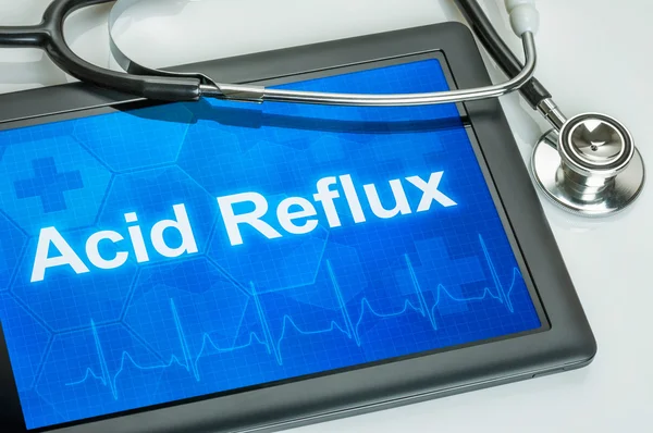 Comprimé avec le diagnostic Acid Reflux sur l'écran — Photo