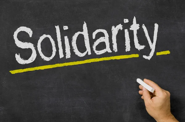 Solidarity written on a blackboard — Stock Photo, Image