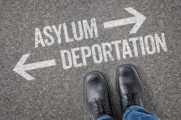 Decision at a crossroad - Asylum or Deportation — Stok fotoğraf