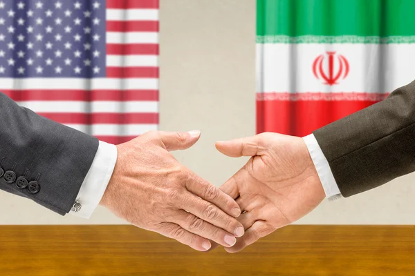 Representatives of the USA and Iran shake hands — Stock Photo, Image