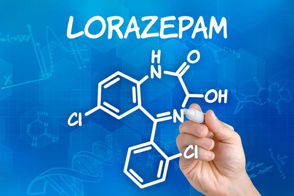 Hand with pen drawing the chemical formula of Lorazepam — Stock Photo, Image