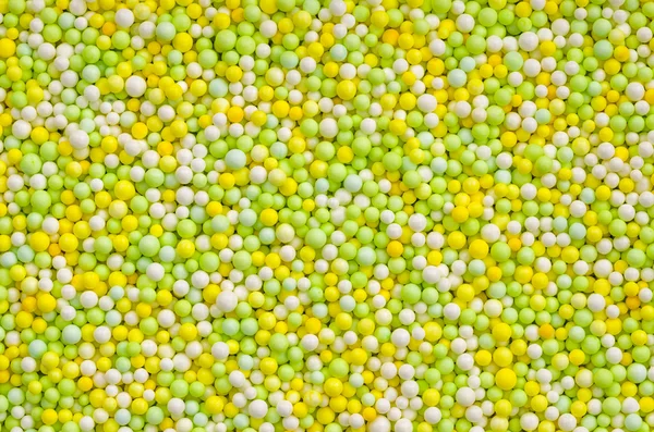 Cukr postřikovačů - žluté a zelené perly — Stock fotografie