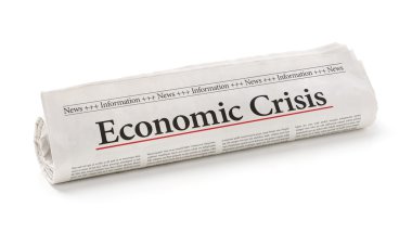 Rolled newspaper with the headline Economic Crisis clipart