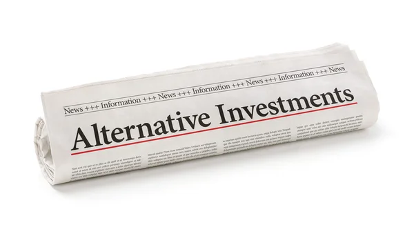 Rolled newspaper with the headline Alternative Investments — Stock Photo, Image