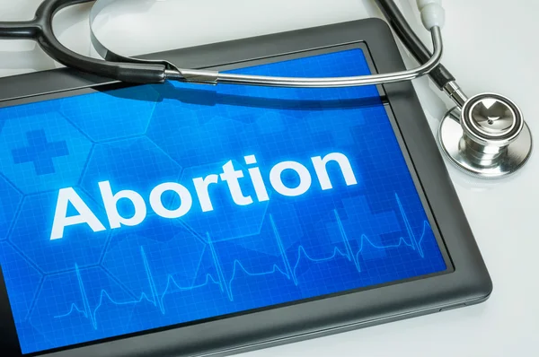 Tablet con il testo aborto sul display — Foto Stock