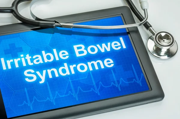 Tablet with the diagnosis Irritable bowel syndrome on the displa — Stock Photo, Image