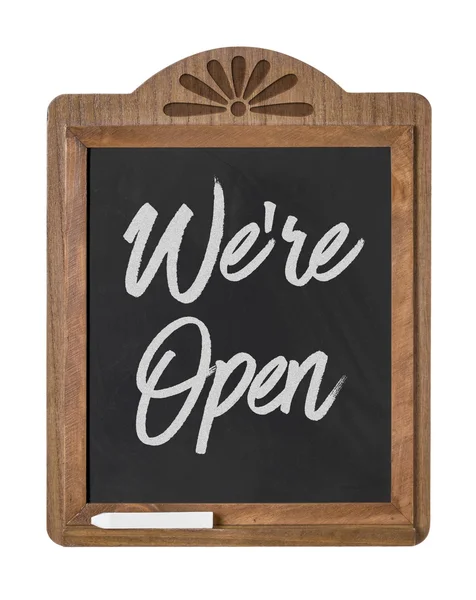 A chalkboard sign on a white background - We are open — Stock Photo, Image