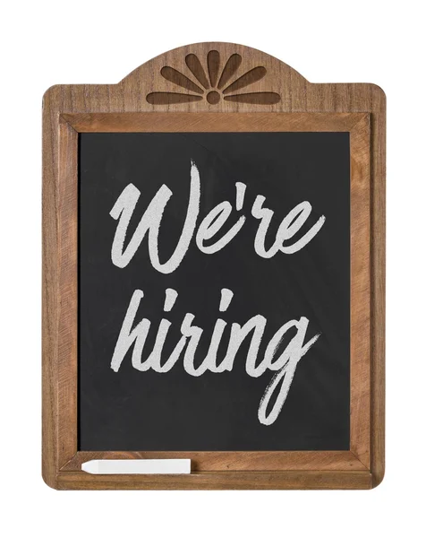 A chalkboard sign on a white background - We are hiring — Stock Photo, Image