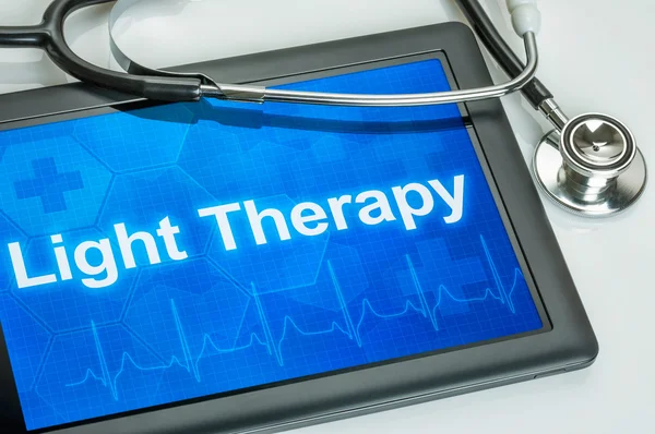 Tablet with the diagnosis Light Therapy on the display — Stock Photo, Image