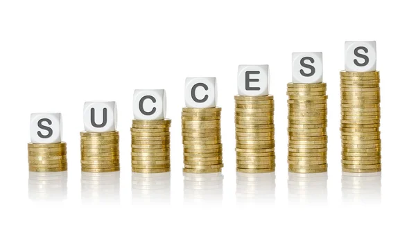 Coin stacks with letter dice - Success — Stock Photo, Image