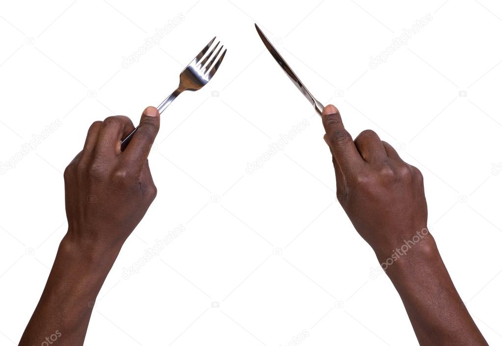 Man holding a fork and a knife
