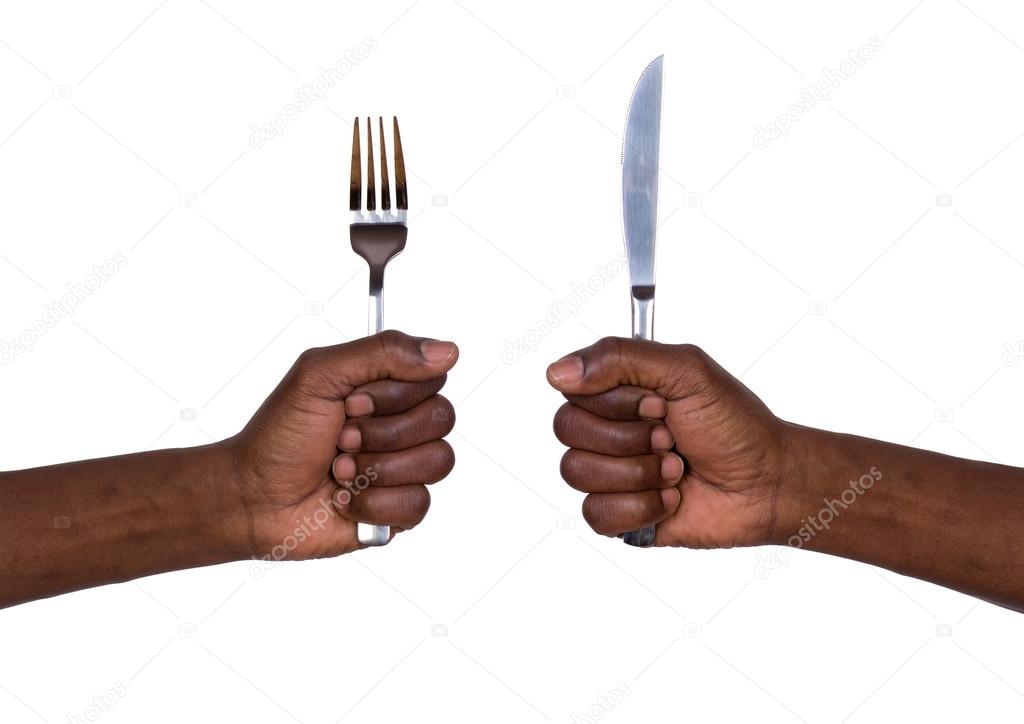 Man holding a fork and a knife