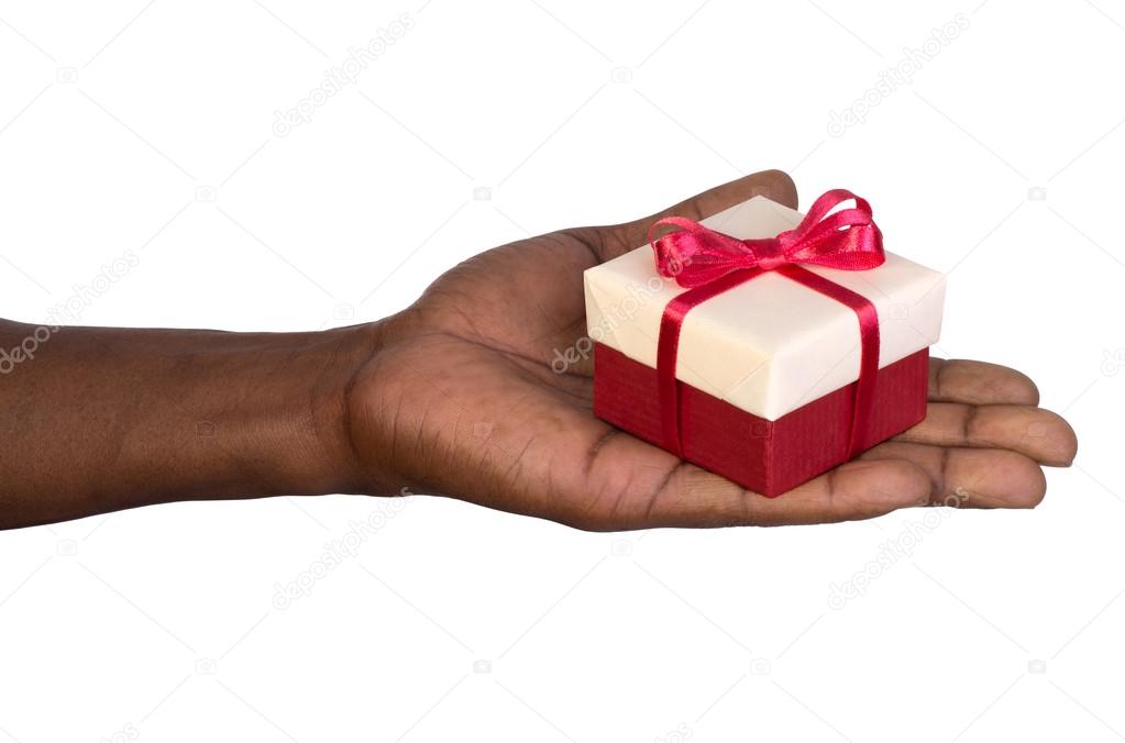 Man holding a gift box in hand isolated on white background