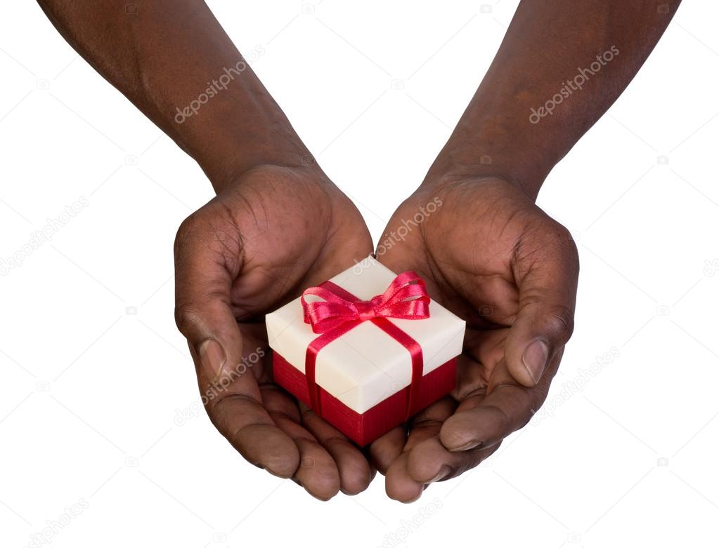 Man holding a gift box in hands isolated on white background