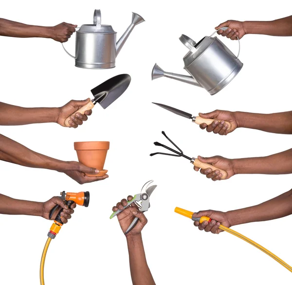 Man holding gardening tools — Stock Photo, Image