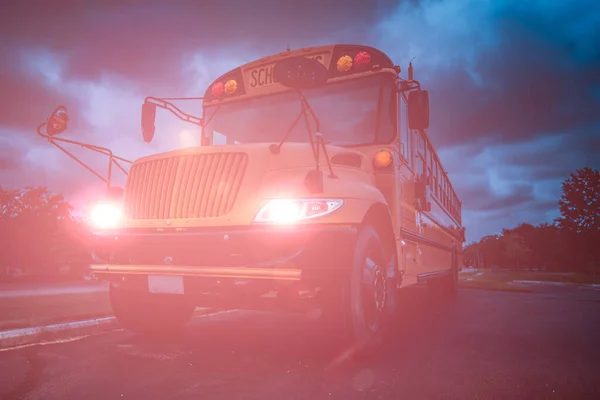 Low Angle Front View Yellow American Public School Bus Night Stock Picture