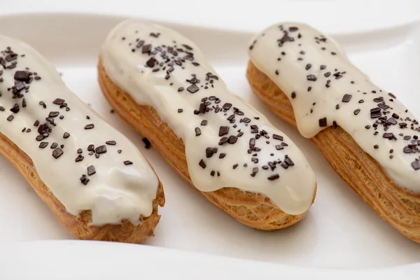 Eclairs with icing custard Royalty Free Stock Photos