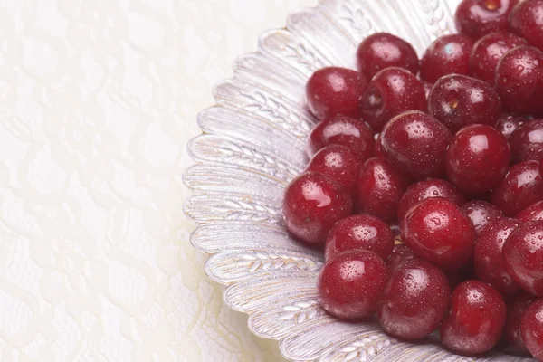 Sour cherry on a silver plate — Stock Photo, Image