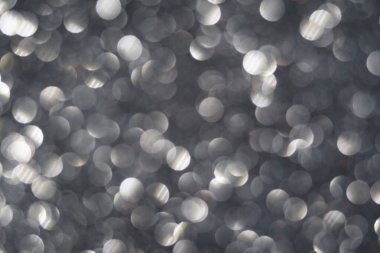 Gümüş ve gri soyut ışıklar arka plan, parlayan bokeh, ışıldayan ve parıldayan arkaplan bulanık görüntü