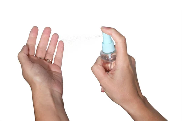 Vrouwelijke Handen Die Ontsmettingsspray Gebruiken Virussen Voorkomen Geïsoleerd Witte Achtergrond — Stockfoto