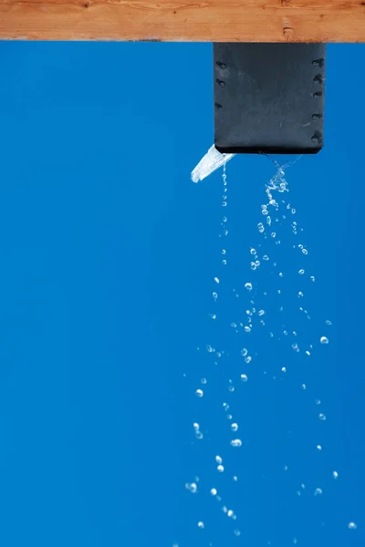 Melted Water Pouring Draining Gutter Blue Sky Background — Stock Photo, Image