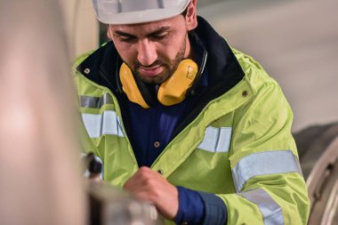 Worker Engineer working machine in factory are Engineering control