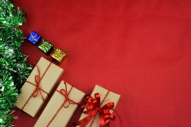 Gift box on red background for Merry Christmas, Brown gift box for happy new yearGift box on red background for Merry Christmas, Brown gift box for happy new year
