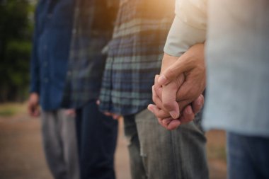 Group people hand in hand concept partner teamwork community