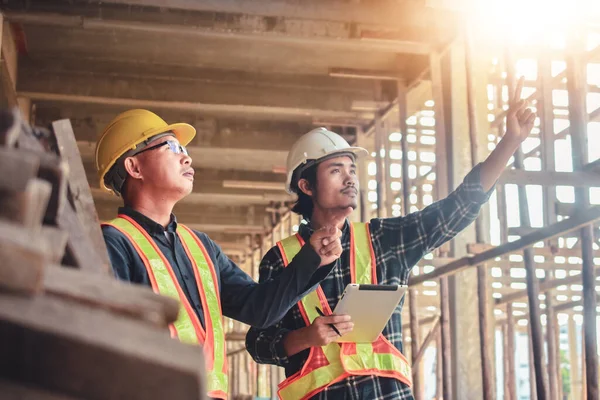 Two Engineer inspection on site building construction to control quality