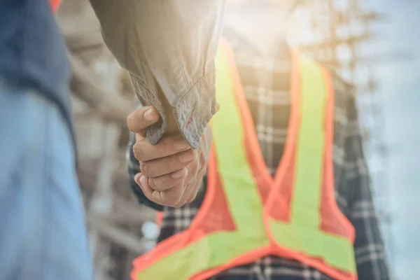 Business people shake hand on site building real estate project ,Hand shake business agreement