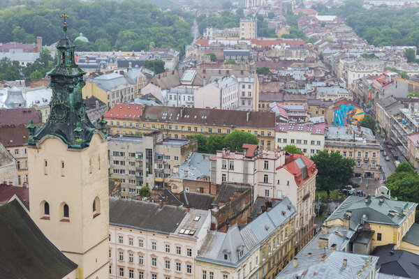 Lvov, Ukraine - 06/14/2021: Lvov panorama landmark, top view. Historical center of Lviv. Church and ancient buildings in Lvov, view from above. Old square called Rynok. Summer travel in Ukraine.
