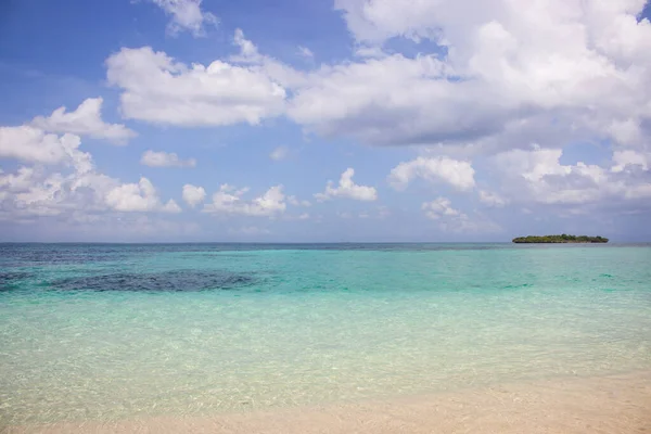 Tropical island landscape. Scenic seascape with azule water and island on background. Coastline of african island. Beautiful lagoon landscape. Vacations in Africa. Tropical travel.