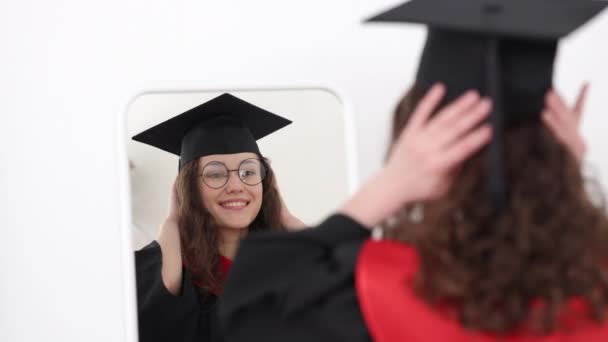College young woman graduate with mortarboard at home Spbi