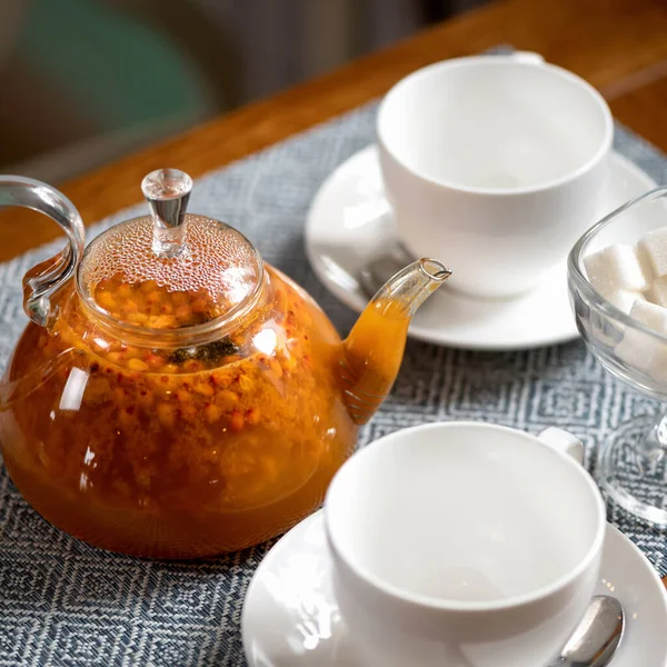 Hot orange drink, Sea buckthorn tea. Natural Berry beverage, prevention of flu and colds in autumn-winter season