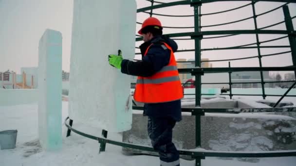 Sling Fitter Jacket Helmet Unloads Ice Blocks — Stock Video
