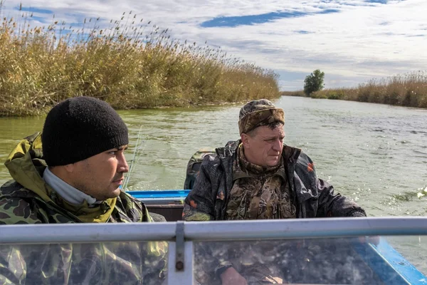 Fishermen in a boat — Stock Photo, Image