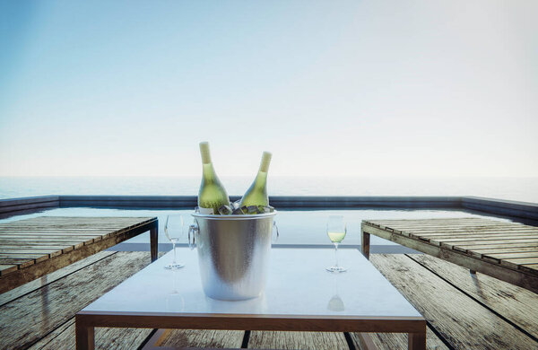 Wine glasses and wine bottles are placed on the table with seats. Pool side sea view