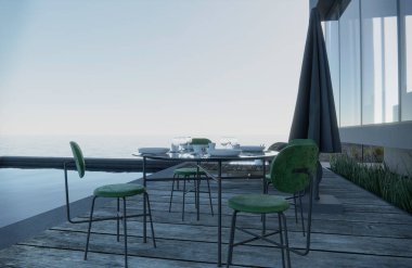 Şarap kadehleri koltuklu masaya konur. Havuz kenarı deniz manzarası