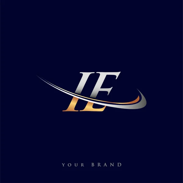 Ie最初的标识公司名称为彩色金色和银色Swoosh设计 独立于白色背景 企业和公司标识的矢量标识 — 图库矢量图片