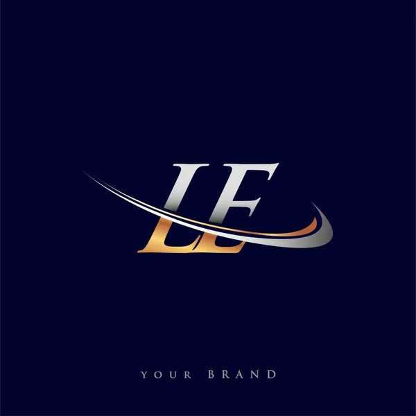 Le最初的标识公司名称为彩色金色和银色Swoosh设计 独立于白色背景 企业和公司标识的矢量标识 — 图库矢量图片