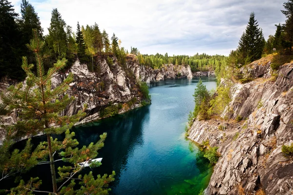 Marble quarry flooded in past in Karelia — Stock Image Marble quarry flooded in past in Karelia Royalty Free Stock Photos