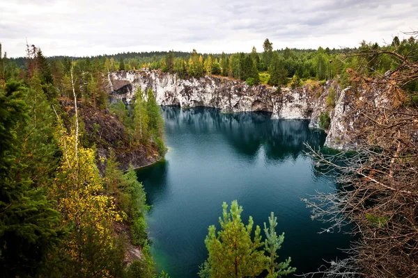 Marble quarry flooded in past in Karelia — Stock Image Marble quarry flooded in past in Karelia Stock Photo