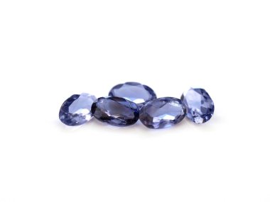 Iolite gemstone oval shaped on a white background clipart