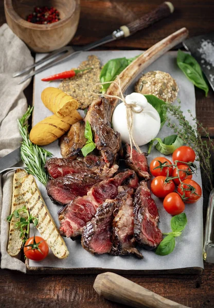 Tomahawk Grilled Steak Cut Pieces Vegetables Wooden Board Cooking Meat — Stock Photo, Image