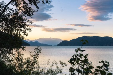 View of Harrison Lake, BC, Canada and mountains at sunset in Jul