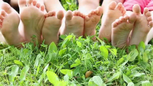 Children Sitting Row Bare Feet Grass — Stockvideo