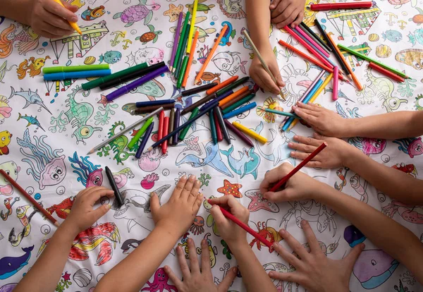 Kids Holding Pencils Crayons Top View — Fotografia de Stock