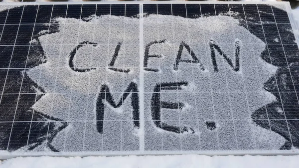 Clean me. Solar panel in the snow. Solar cells generate less energy during precipitation, shade, at night, in rain.close-up